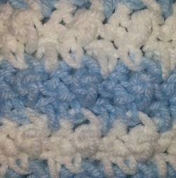 blue and white crocheted afghan