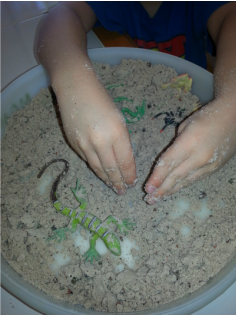Sensory Activity Child's hands in flour and oil